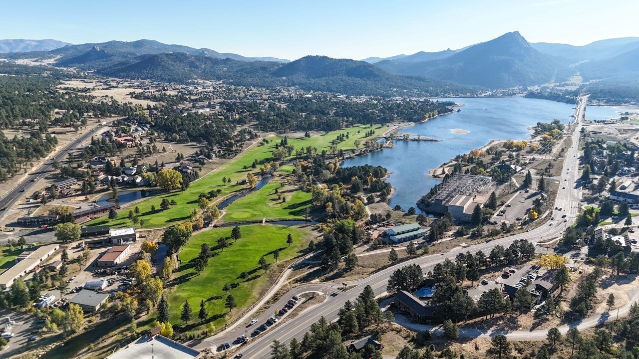 Aerial view of Estes Park with Lake Estes and the surrounding peaks